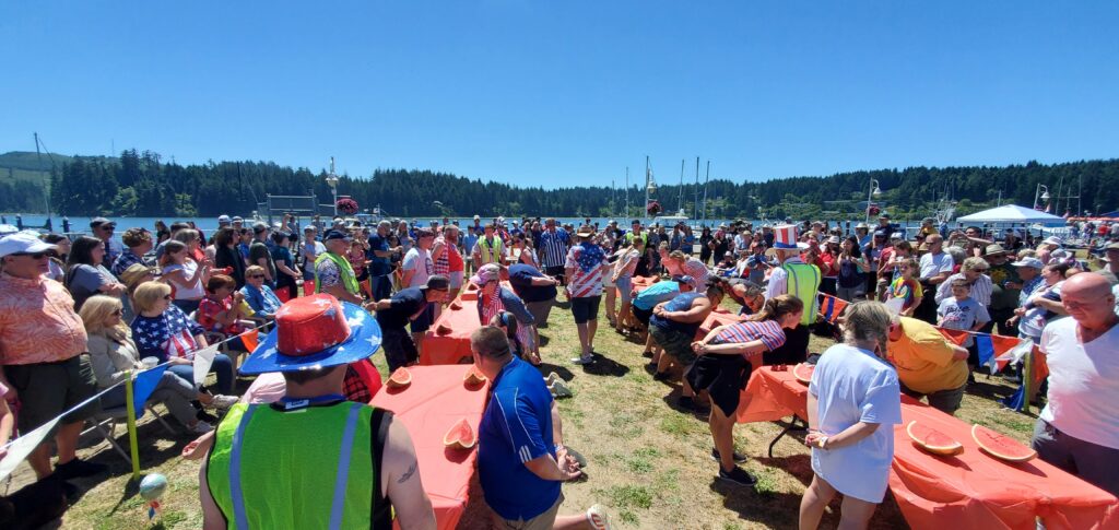 Crowd gathered at Siuslaw River port for watermelon eating contest