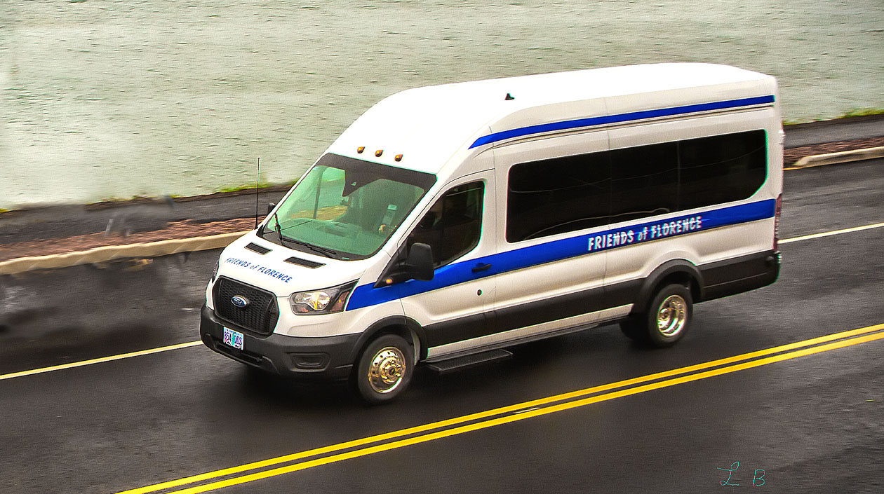 Friends of Florence white bus with blue stripe